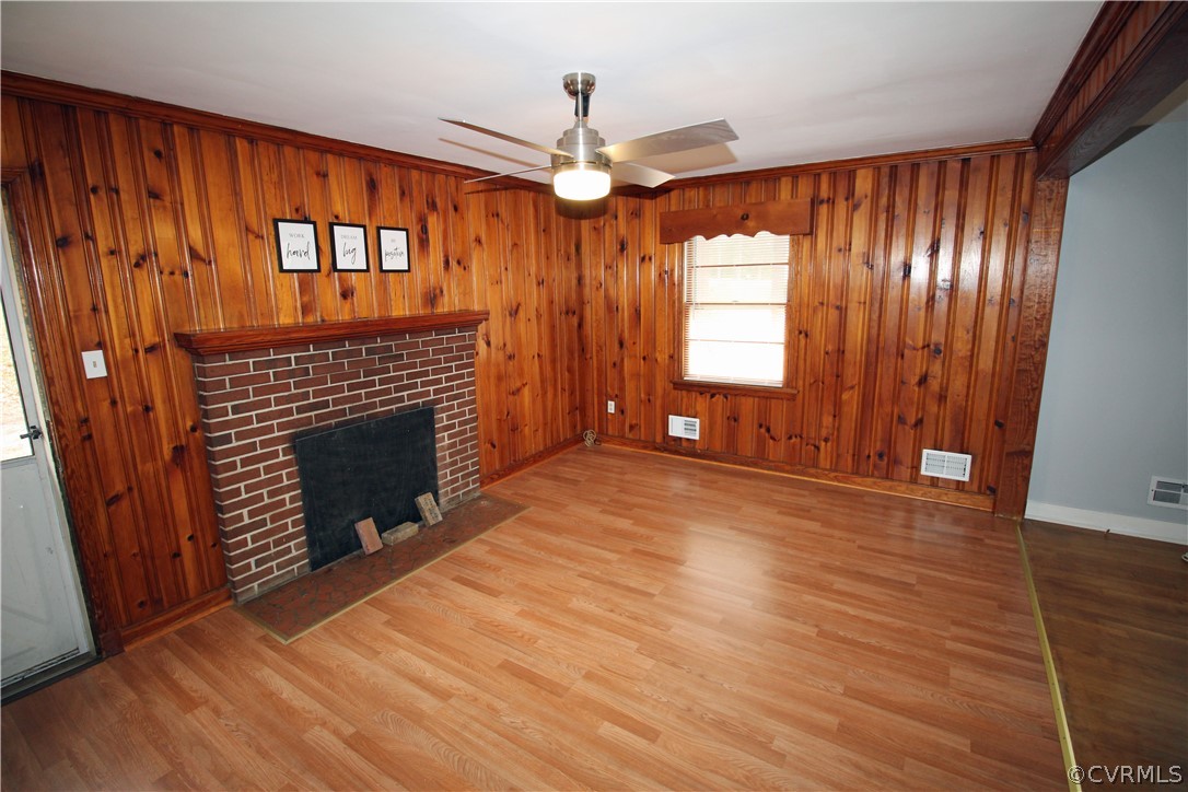 12821 Old Buckingham Road Midlothian, VA 23113 - Photo 26 of 50 a view of an empty room with wooden floor fireplace and a window