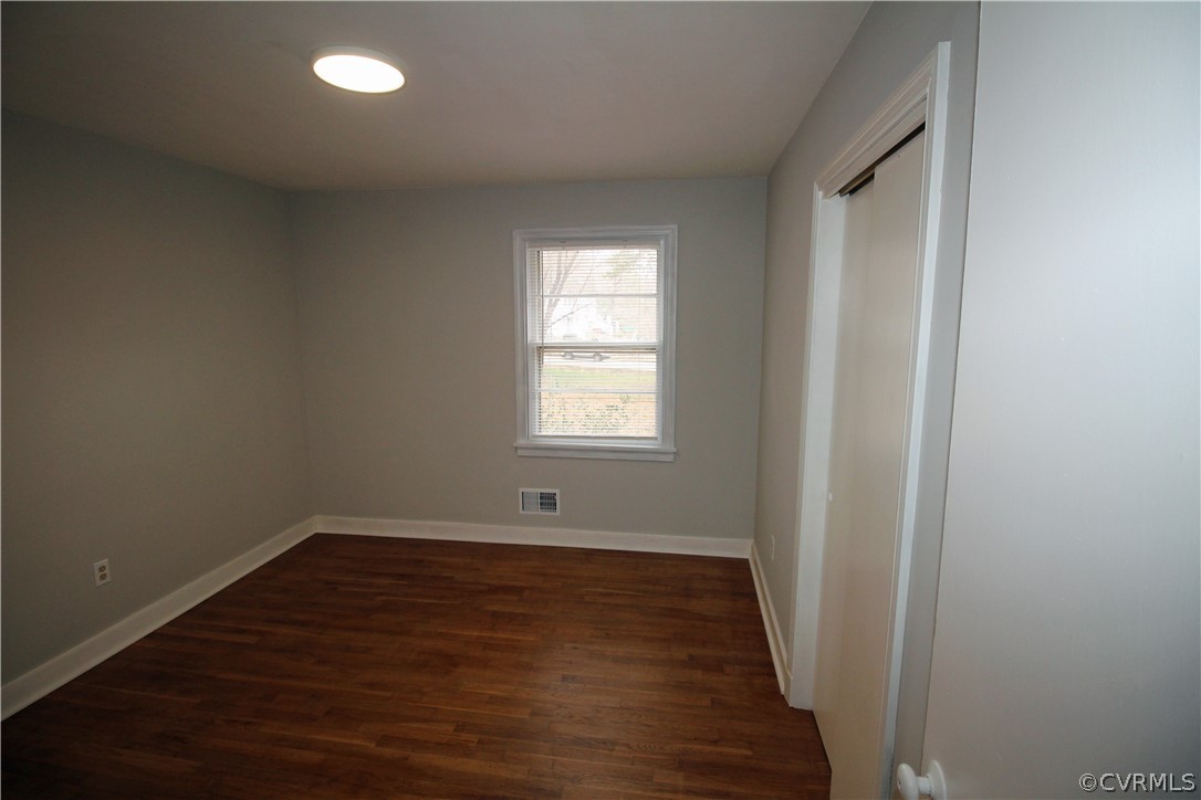 12821 Old Buckingham Road Midlothian, VA 23113 - Photo 28 of 50 an empty room with wooden floor and windows