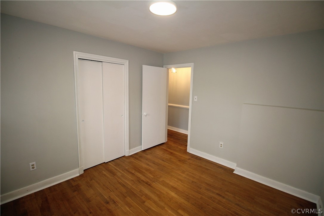 12821 Old Buckingham Road Midlothian, VA 23113 - Photo 29 of 50 an empty room with wooden floor and windows