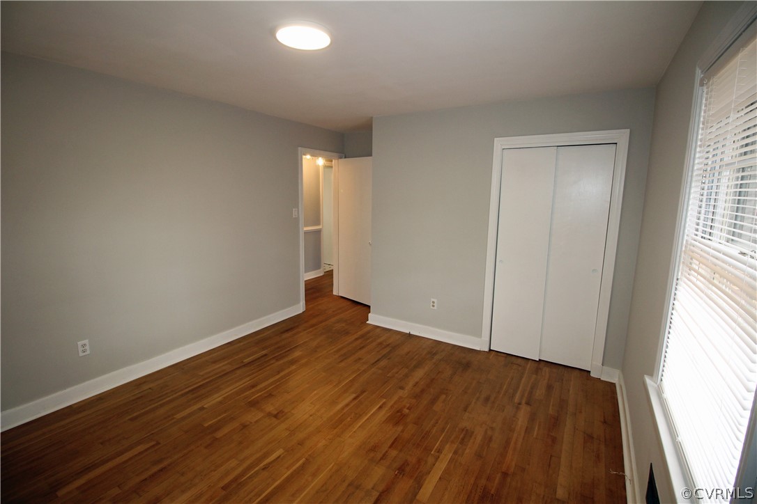 12821 Old Buckingham Road Midlothian, VA 23113 - Photo 32 of 50 an empty room with wooden floor and windows