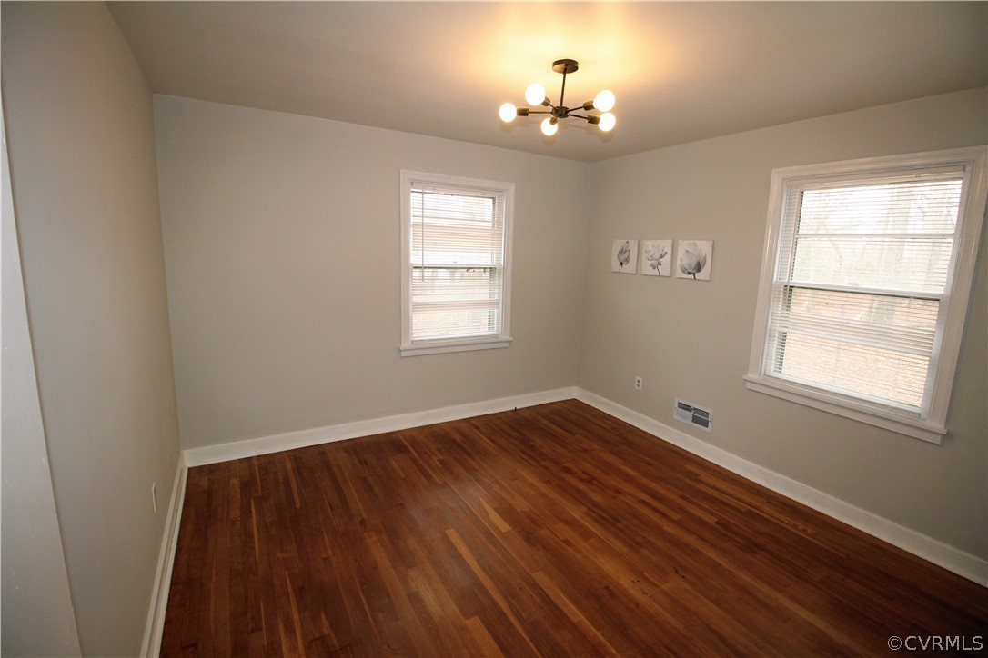 12821 Old Buckingham Road Midlothian, VA 23113 - Photo 33 of 50 a view of an empty room with wooden floor and a window