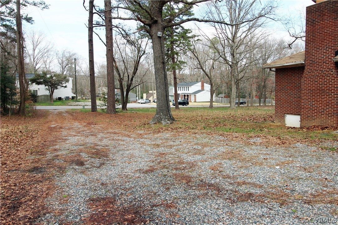 12821 Old Buckingham Road Midlothian, VA 23113 - Photo 37 of 50 a view of a yard with a trees