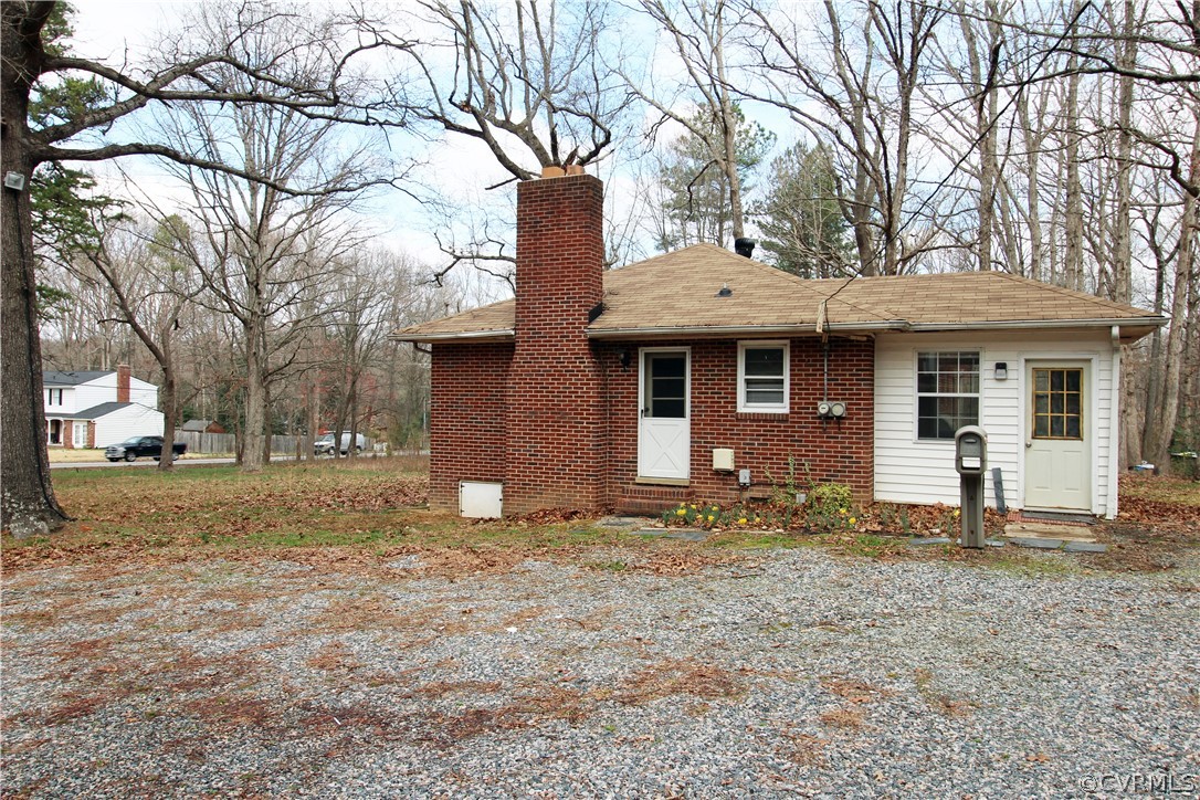 12821 Old Buckingham Road Midlothian, VA 23113 - Photo 38 of 50 a front view of a house with a yard