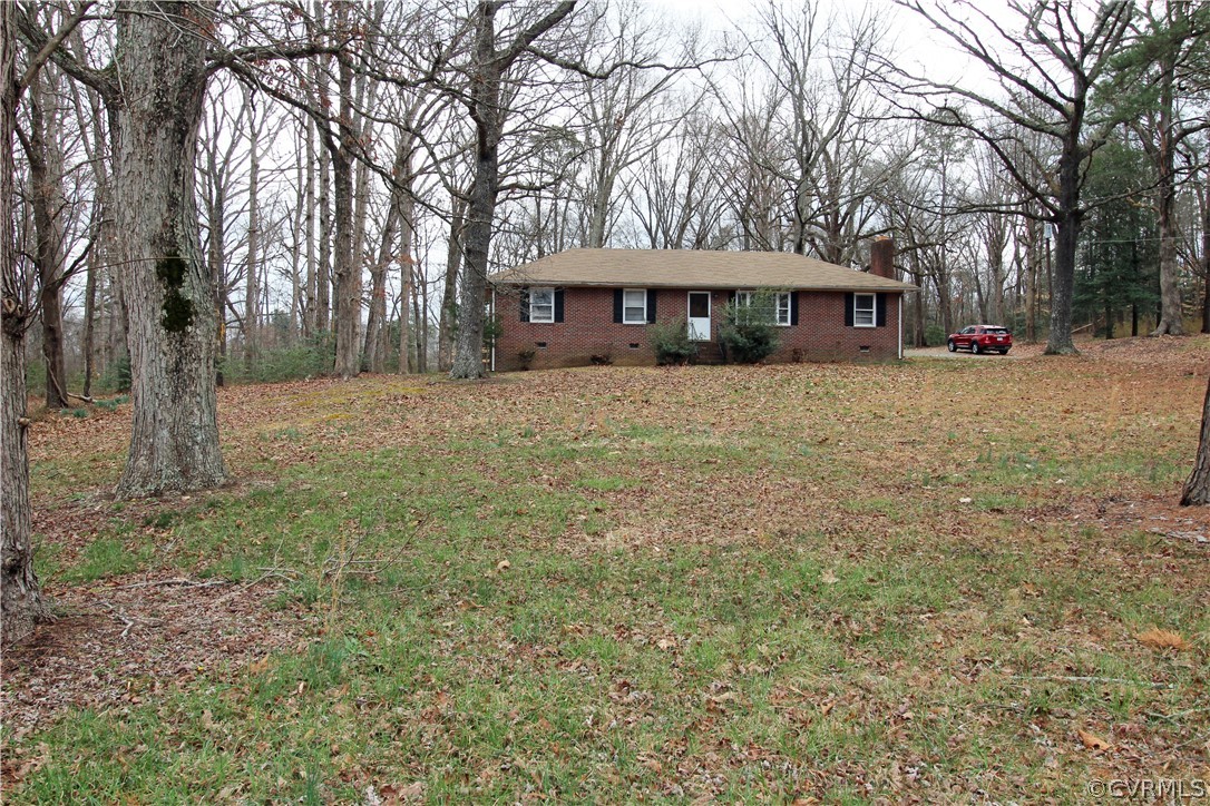 12821 Old Buckingham Road Midlothian, VA 23113 - Photo 48 of 50 a view of a house with a yard