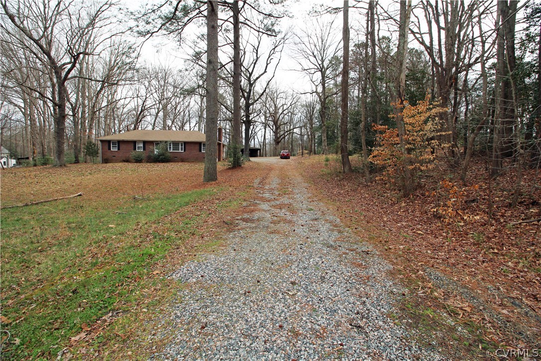 12821 Old Buckingham Road Midlothian, VA 23113 - Photo 50 of 50 a view of house with trees in the background