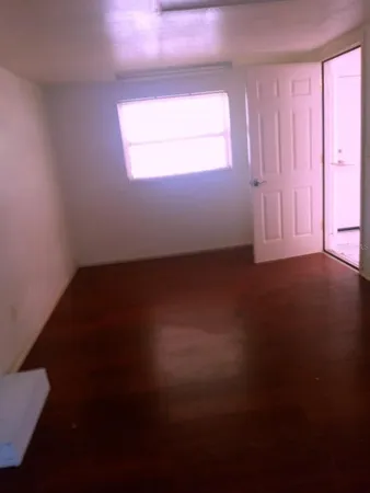 a view of an empty room and window