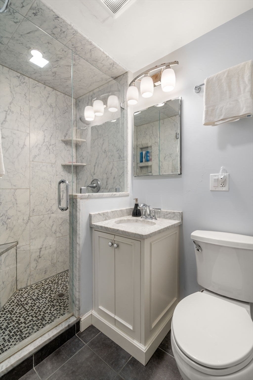 48 Gary Road Needham, MA 02494 - Photo 16 of 20 a bathroom with a sink a toilet and shower
