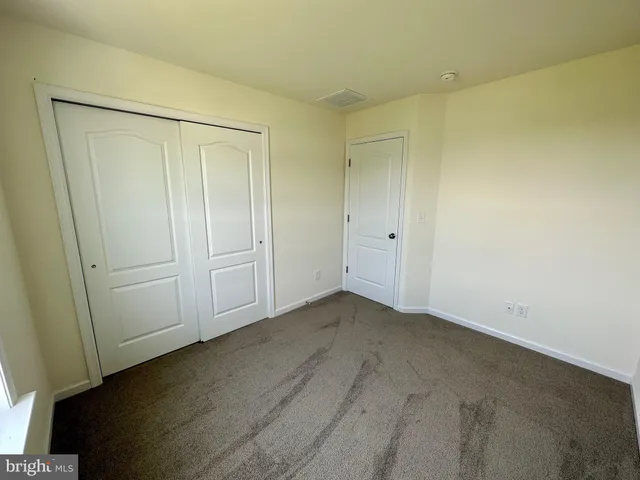 an empty room with wooden floor