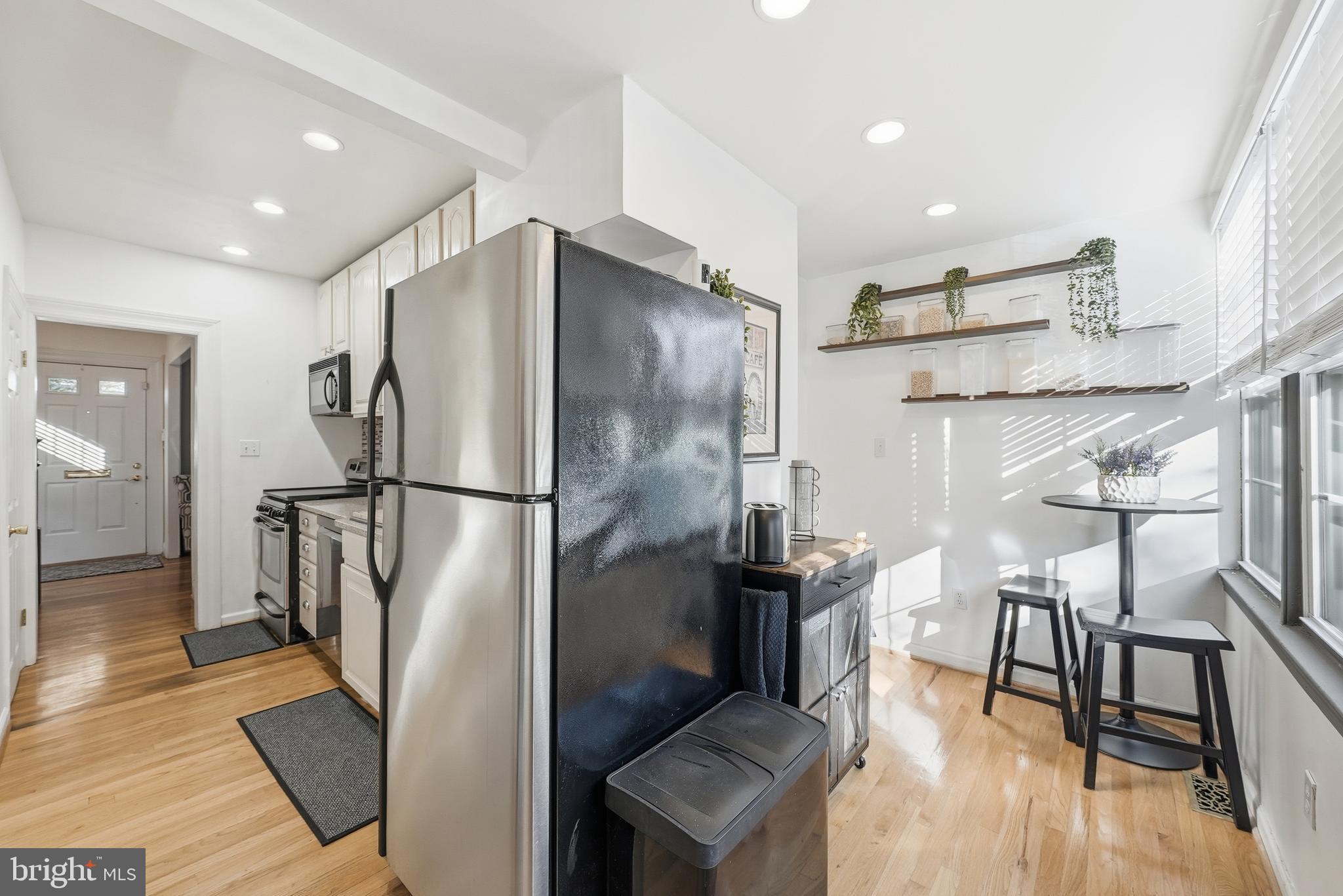 3921 22nd Street Northeast Washington, DC 20018 - Photo 9 of 28 a kitchen with stainless steel appliances granite countertop a refrigerator and a stove top oven