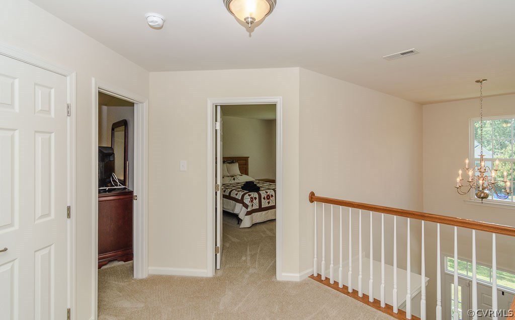 6100 Arbor Ridge Chester, VA 23831 - Photo 8 of 27 a view of a hallway to a livingroom with furniture