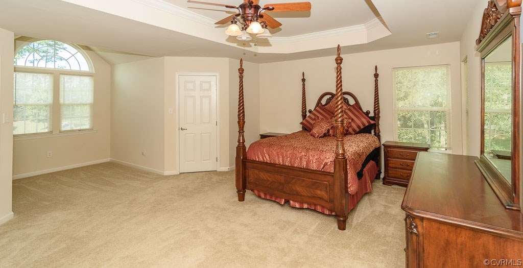 6100 Arbor Ridge Chester, VA 23831 - Photo 9 of 27 a bedroom with a bed and a chandelier