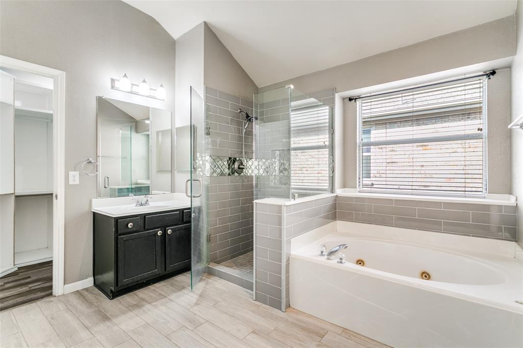 2408 Graystone Lane Corinth, TX 76210 - Photo 12 of 17 a bathroom with a tub sink and mirror