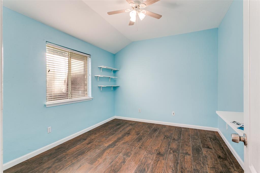 2408 Graystone Lane Corinth, TX 76210 - Photo 14 of 17 wooden floor in an empty room with a window