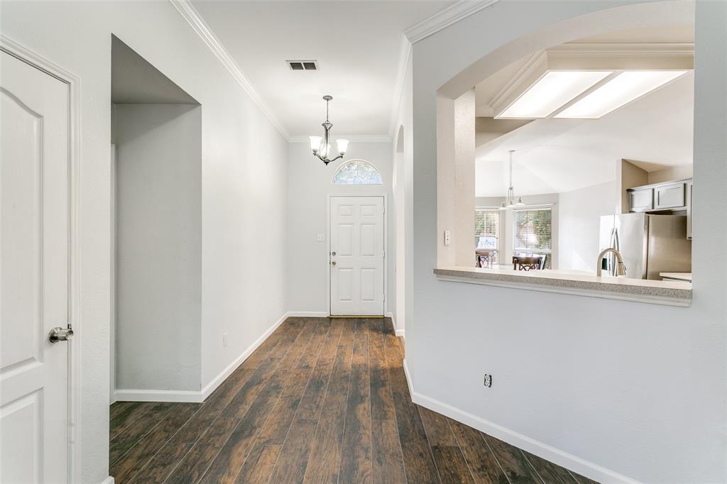 2408 Graystone Lane Corinth, TX 76210 - Photo 2 of 17 a view of a kitchen cabinets and wooden floor