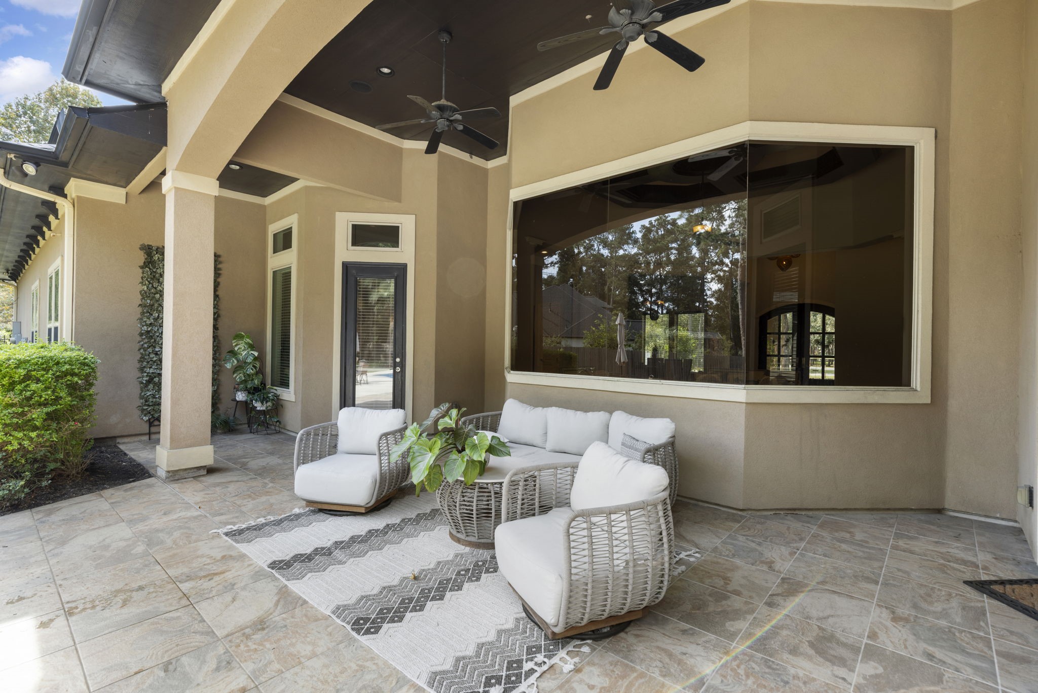 4103 Tee Tree Court Spring, TX 77386 - Photo 28 of 37 Plenty of room to relax in the shade while still enjoying the pool and backyard views. The large covered patio connects easily to the main living areas and outdoor entertaining spaces.