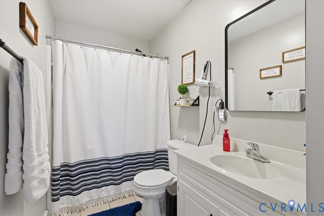 13504 Taylor Drive Disputanta, VA 23842 - Photo 13 of 49 a bathroom with a sink and toilet