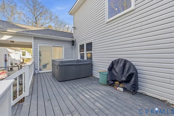 a view of a yard with plants and trees
