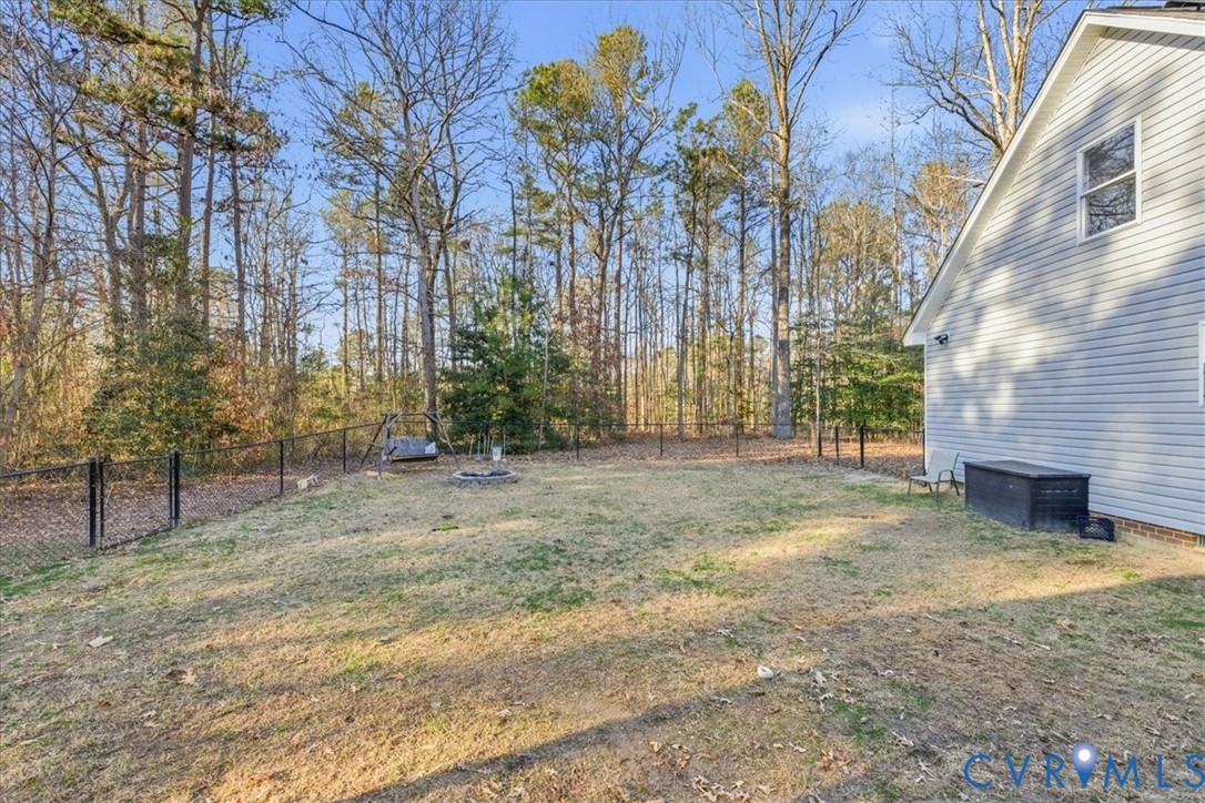 13504 Taylor Drive Disputanta, VA 23842 - Photo 20 of 49 a view of a yard with plants and trees
