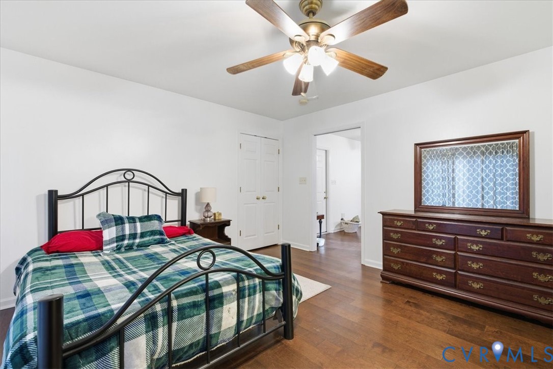 13504 Taylor Drive Disputanta, VA 23842 - Photo 24 of 49 a bedroom with furniture and a chandelier