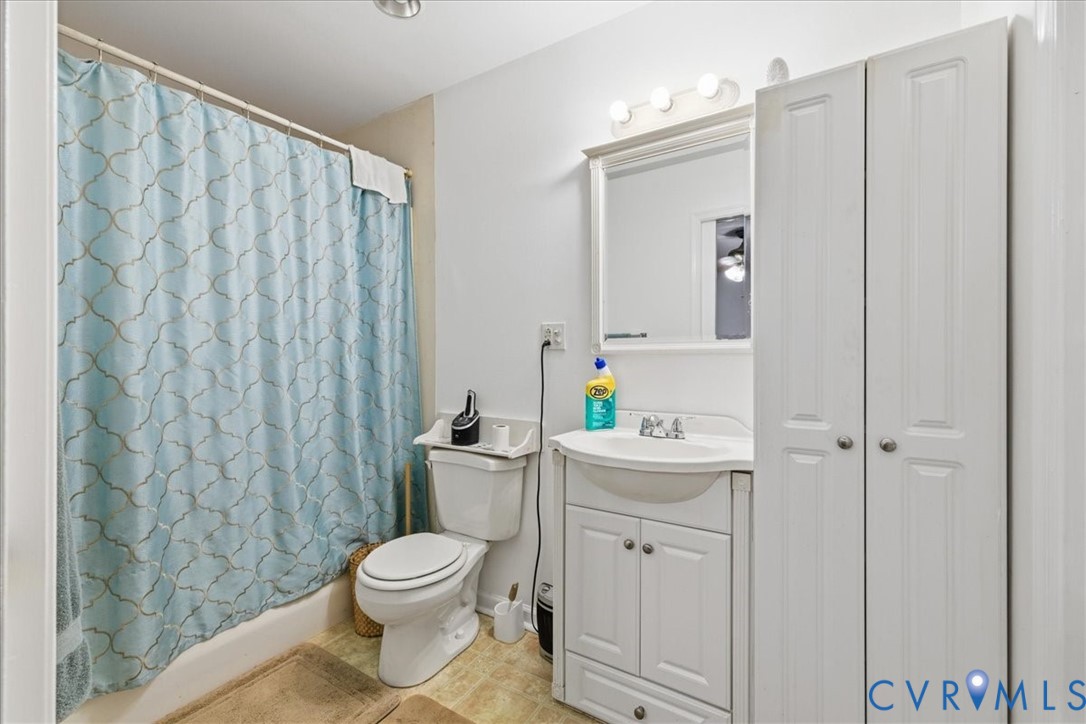 13504 Taylor Drive Disputanta, VA 23842 - Photo 25 of 49 a white toilet sitting next to a bathroom sink