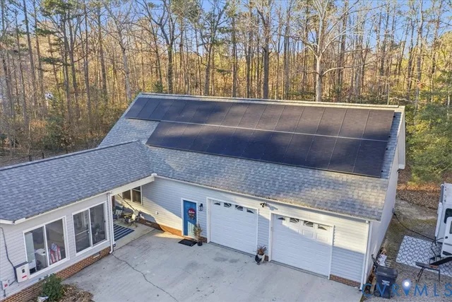 a view of residential houses with a street