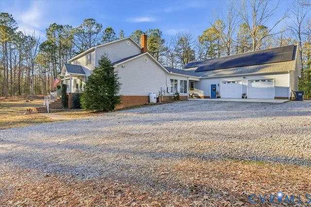 a living room with fireplace furniture and a flat screen tv