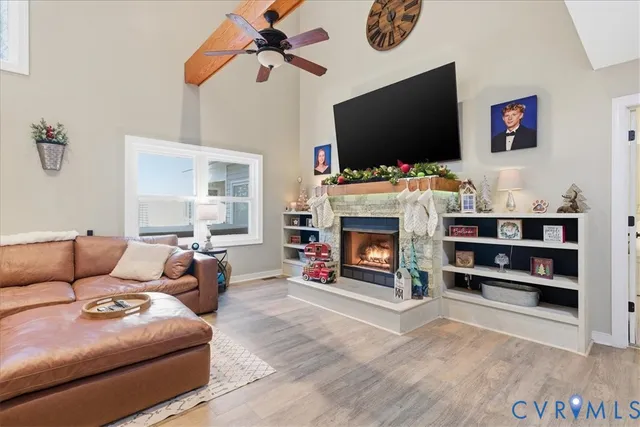 a kitchen with granite countertop white cabinets and stainless steel appliances