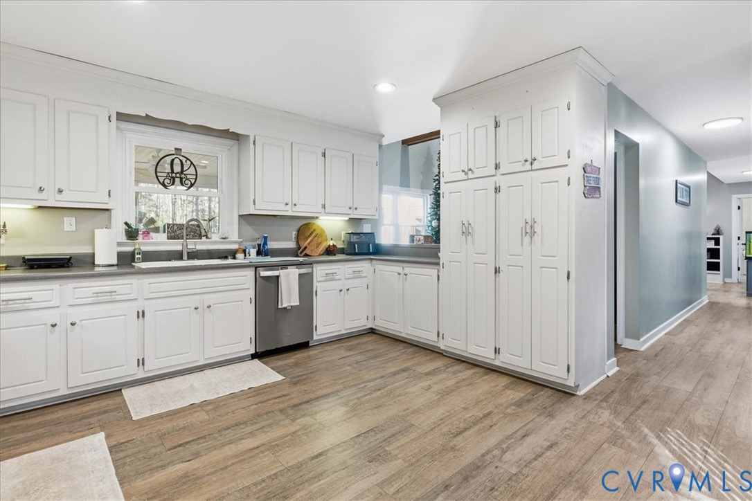 13504 Taylor Drive Disputanta, VA 23842 - Photo 38 of 49 a kitchen with granite countertop white cabinets white stainless steel appliances and sink