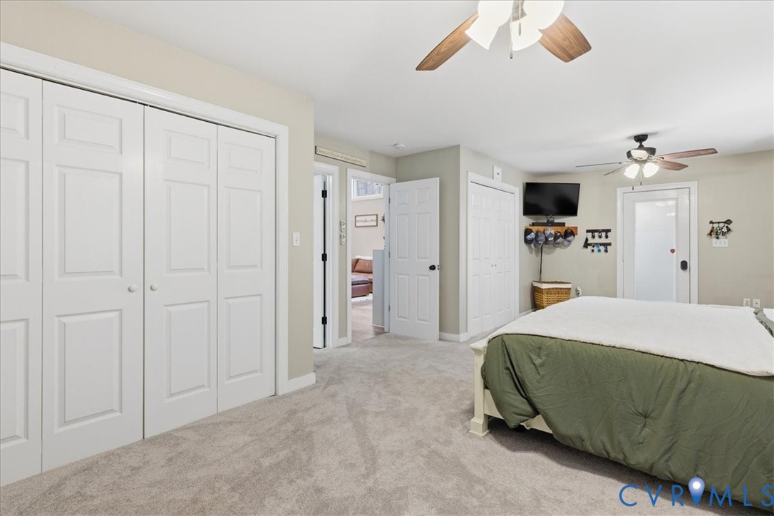 13504 Taylor Drive Disputanta, VA 23842 - Photo 41 of 49 a room that has a bed and a walk in closet