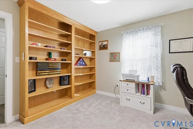 a living room with furniture a fireplace and a table