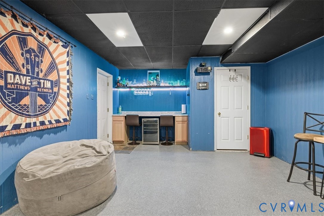 13504 Taylor Drive Disputanta, VA 23842 - Photo 46 of 49 a living room with furniture a fireplace and a table