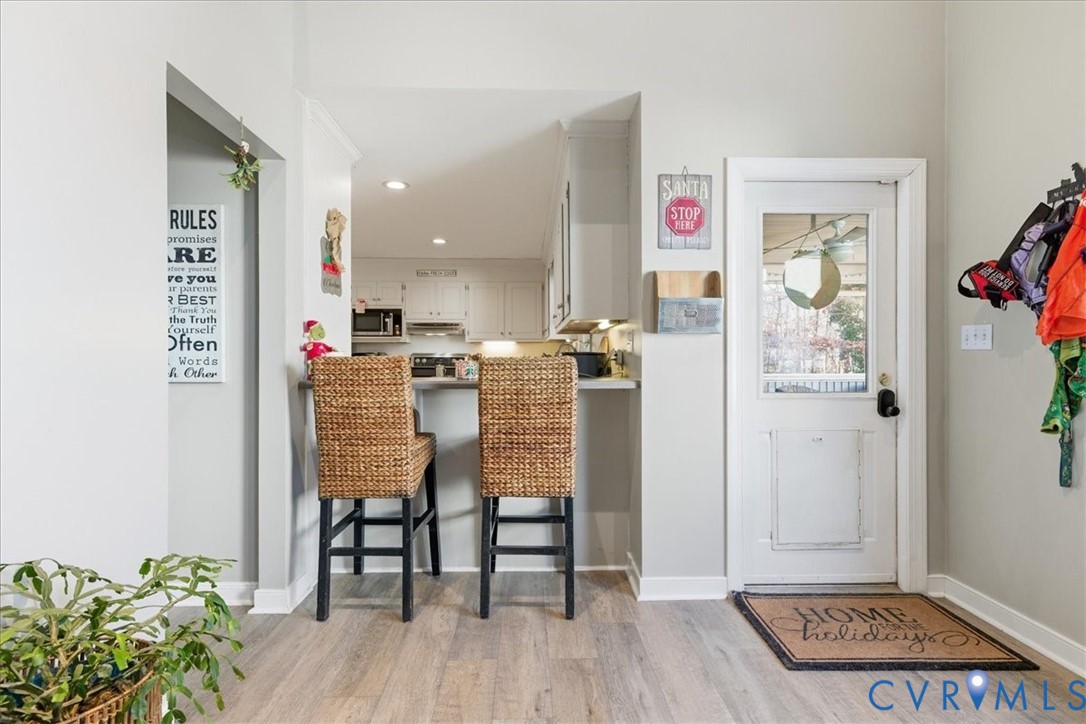 13504 Taylor Drive Disputanta, VA 23842 - Photo 5 of 49 a view of kitchen with furniture and wooden floor