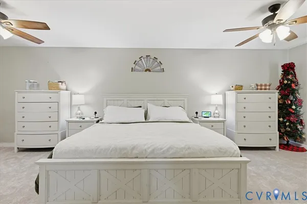 a bathroom with a toilet a sink a mirror and a bathtub