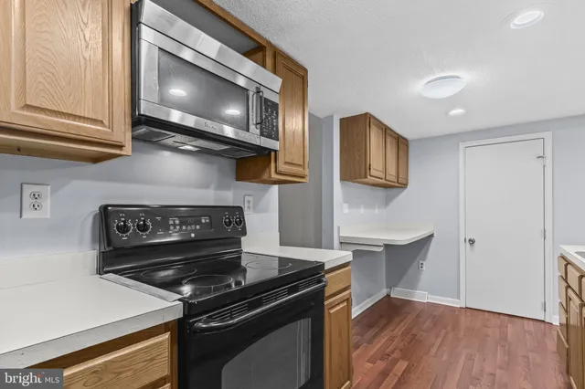 a kitchen with a stove and a microwave