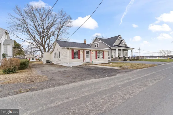 an aerial view of a house with a lake view