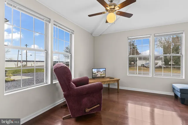 a work room with furniture and windows
