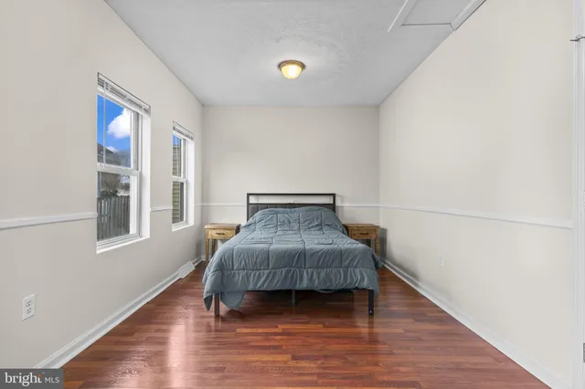 a room with a bed and a window