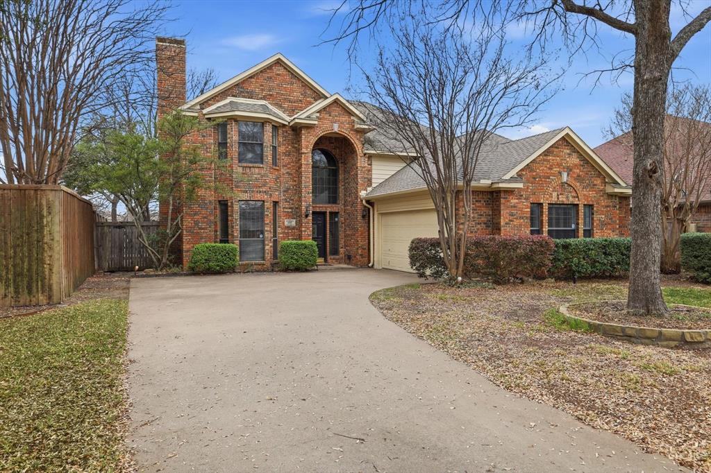605 Andover Lane Coppell, TX 75019 - Photo 1 of 39 a front view of a house with a yard and garage