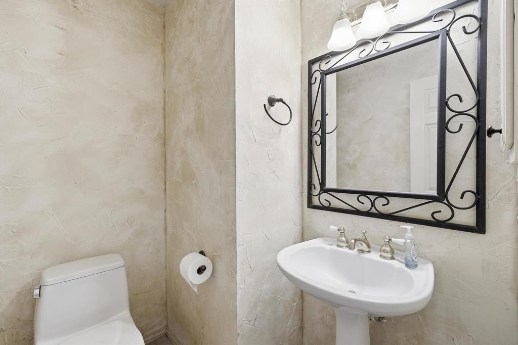 605 Andover Lane Coppell, TX 75019 - Photo 13 of 39 a bathroom with a sink toilet and mirror