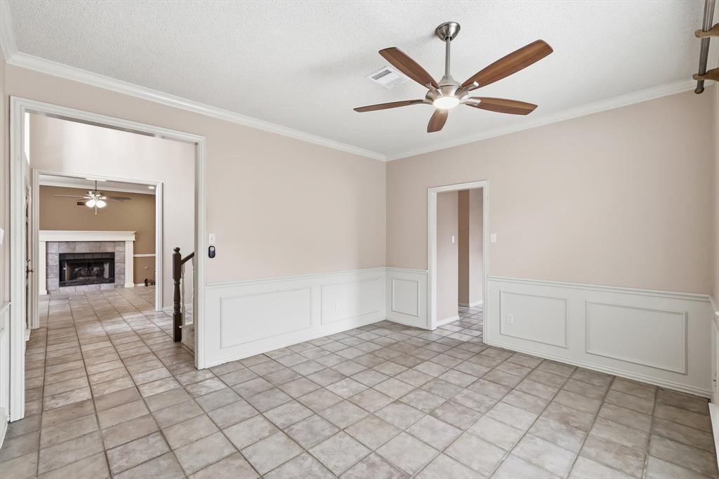 605 Andover Lane Coppell, TX 75019 - Photo 17 of 39 a view of a livingroom with a ceiling fan and wooden floor