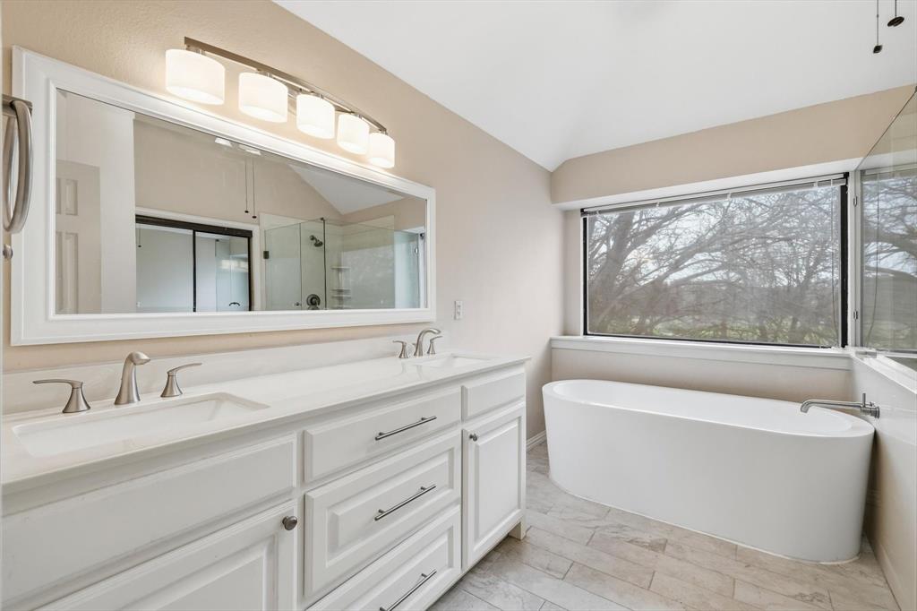 605 Andover Lane Coppell, TX 75019 - Photo 24 of 39 a bathroom with a large tub sink and mirror