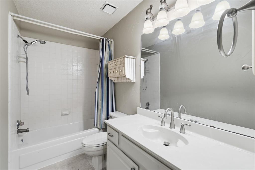 605 Andover Lane Coppell, TX 75019 - Photo 26 of 39 a bathroom with a sink toilet and shower