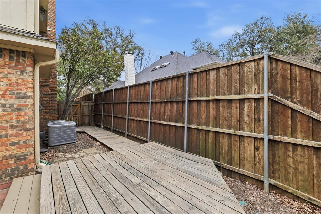 605 Andover Lane Coppell, TX 75019 - Photo 28 of 39 a balcony with wooden floor and fence