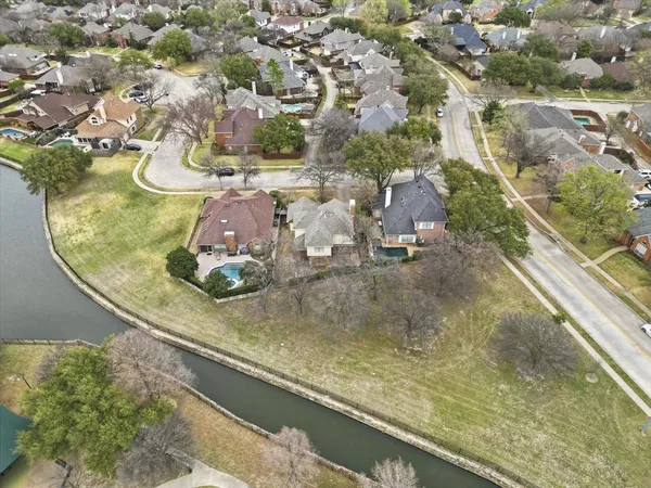 an aerial view of a residential houses with outdoor space