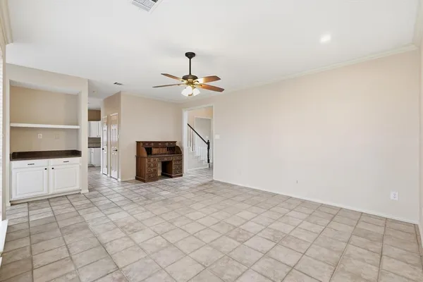 a view of a kitchen with microwave and cabinets
