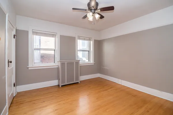 a view of empty room with windows