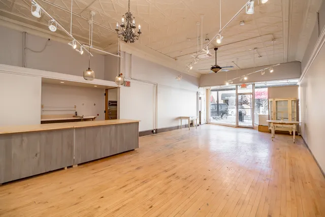 a street with a building and a street sign
