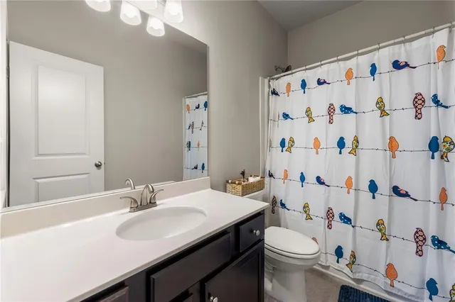 a bedroom with a bed chair and a window