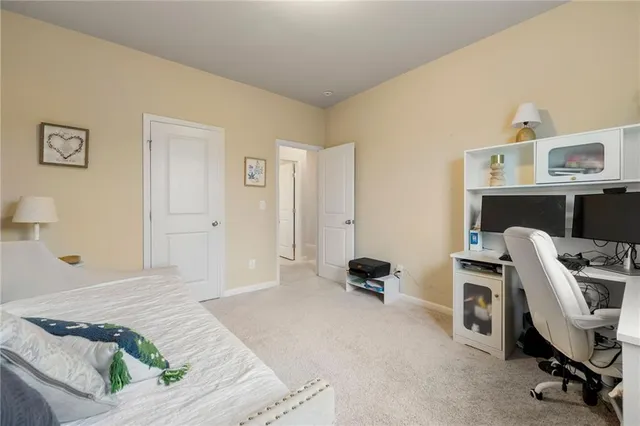 a living room with furniture and a book shelf