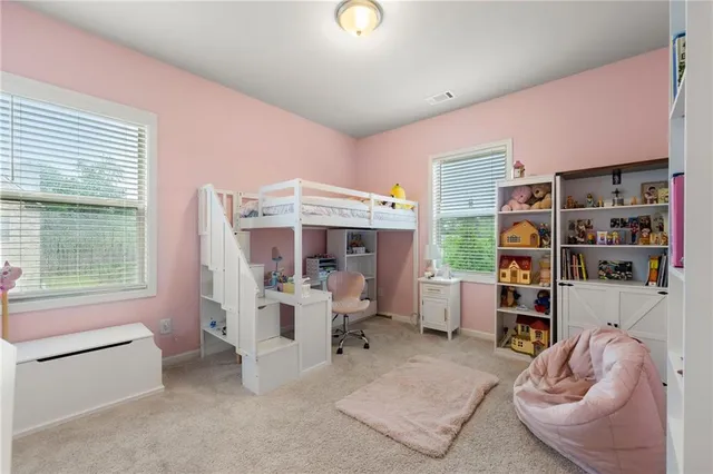 a bedroom with furniture and a couch